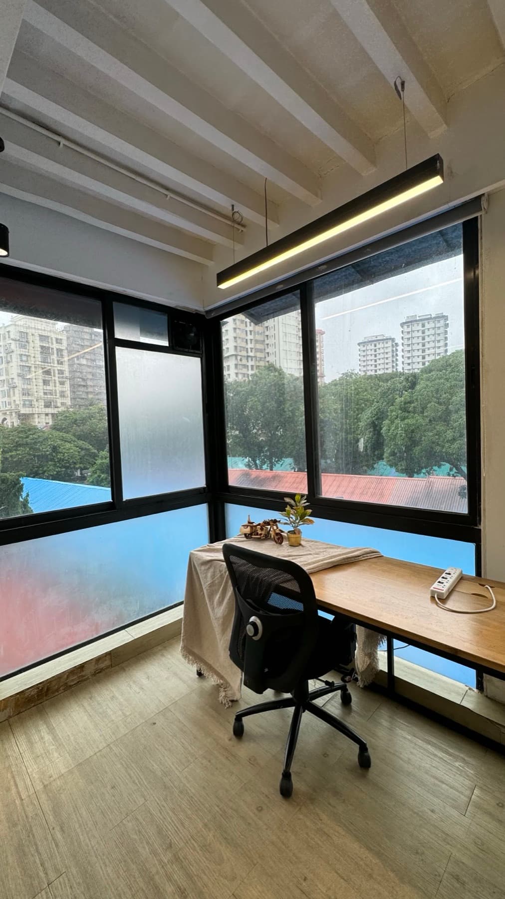 Private cabin with a window-facing desk at Blue Co-Labs